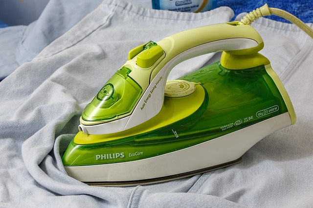 A green color clothing iron showing the importance of ecofriendly laundry