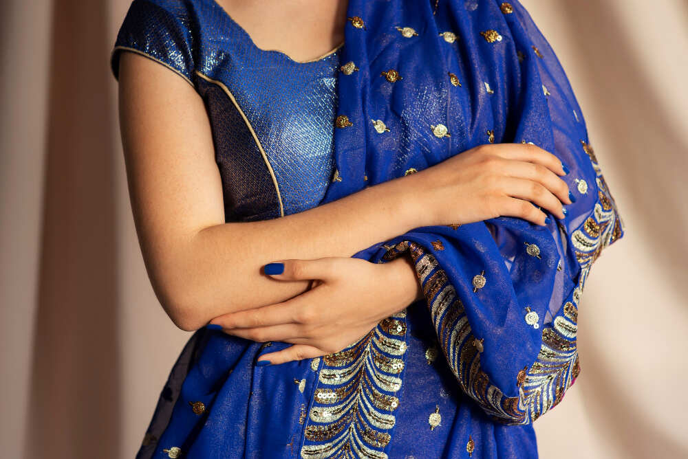 Model showcasing Zari sarees and garments 